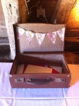 A vintage suitcase for wedding cards